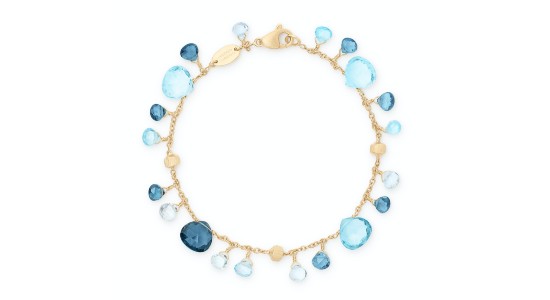 a yellow gold bracelet featuring mixed blue topaz gems