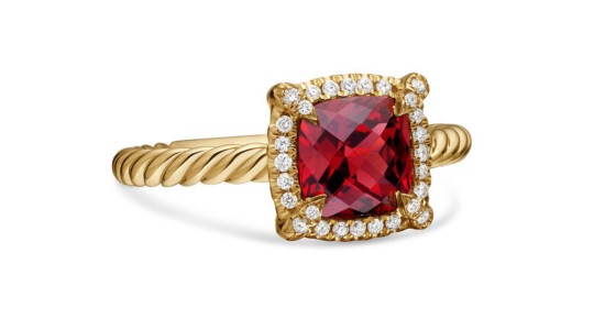 a yellow gold fashion ring featuring a princess cut, halo-set garnet