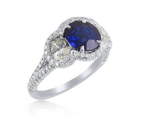 J.B. Star Platinum Blue Sapphire & Diamond Ring, Featuring a 1.52 Carat Round Blue Sapphire, Accented with 2 Oval and Pave Set Round Diamonds =1.78cts Total Weight | Alson Jewelers