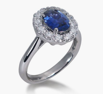 Spark Ring, Fashioned in 18K White Gold, Featuring a 1.60 Carat Oval Blue Sapphire, Accented with Twelve Round Diamonds | Alson Jewelers