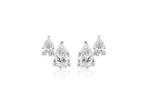 a pair white gold pear shape diamond stud earrings by Alson Jewelers 